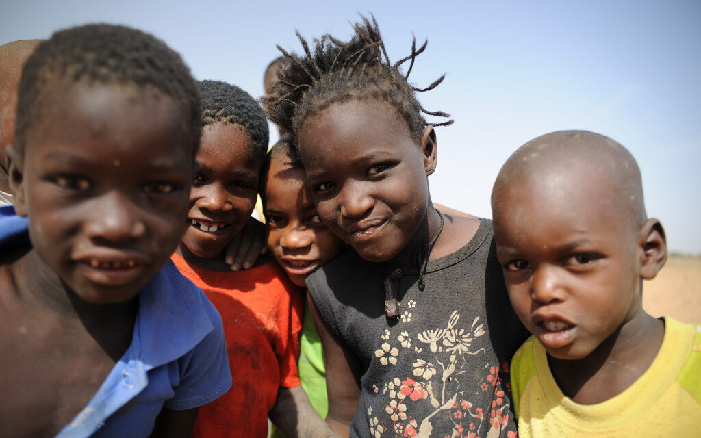 A mother and her children from a community affected by descent-based discrimination.